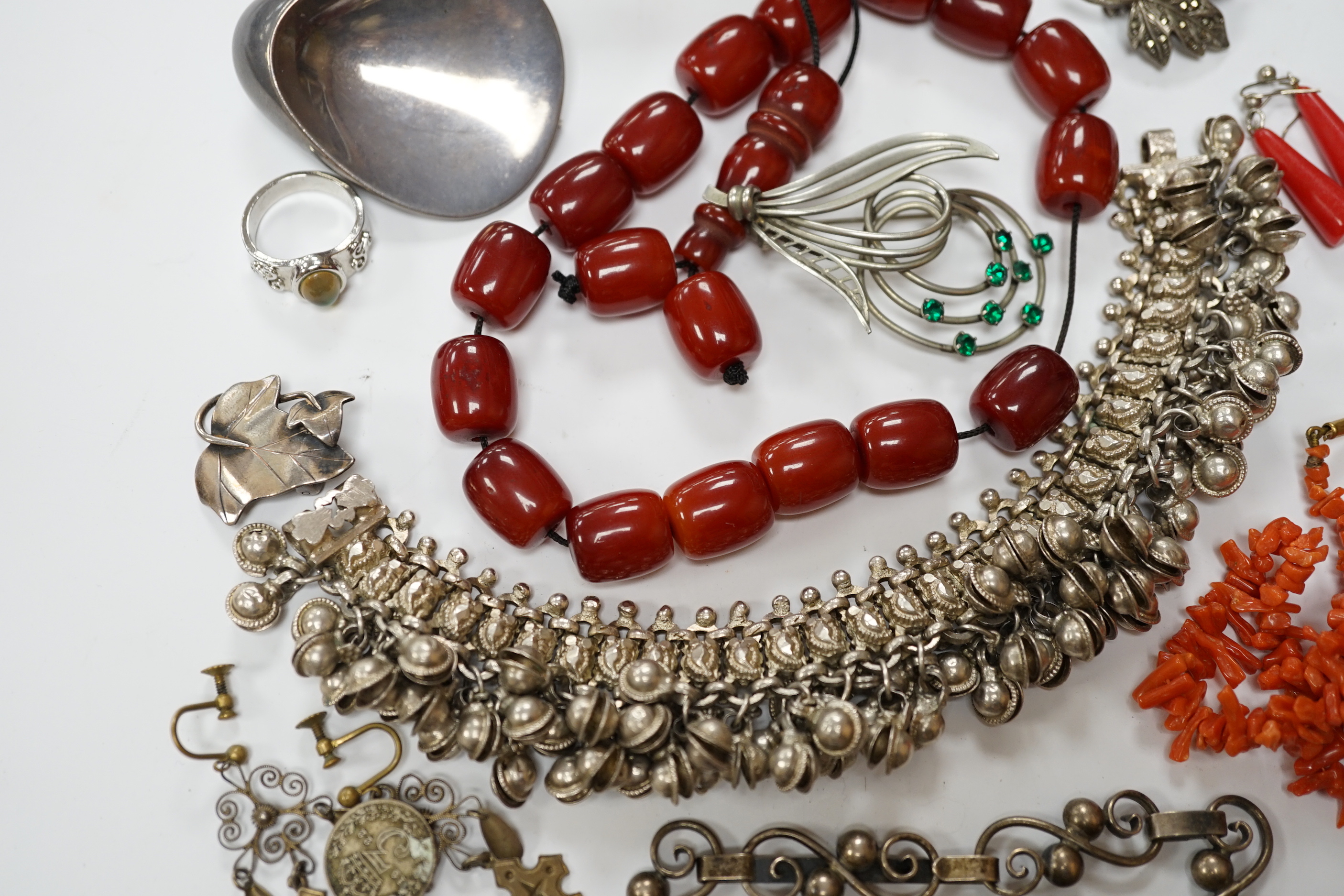 A quantity of assorted jewellery including costume, a pair of Danish sterling ear clips, a 1960's Nanna & Jorgen Ditzel for Georg Jensen sterling silver brooch, no.328, 51mm, a pair of Georg Jensen sterling ear clips, no